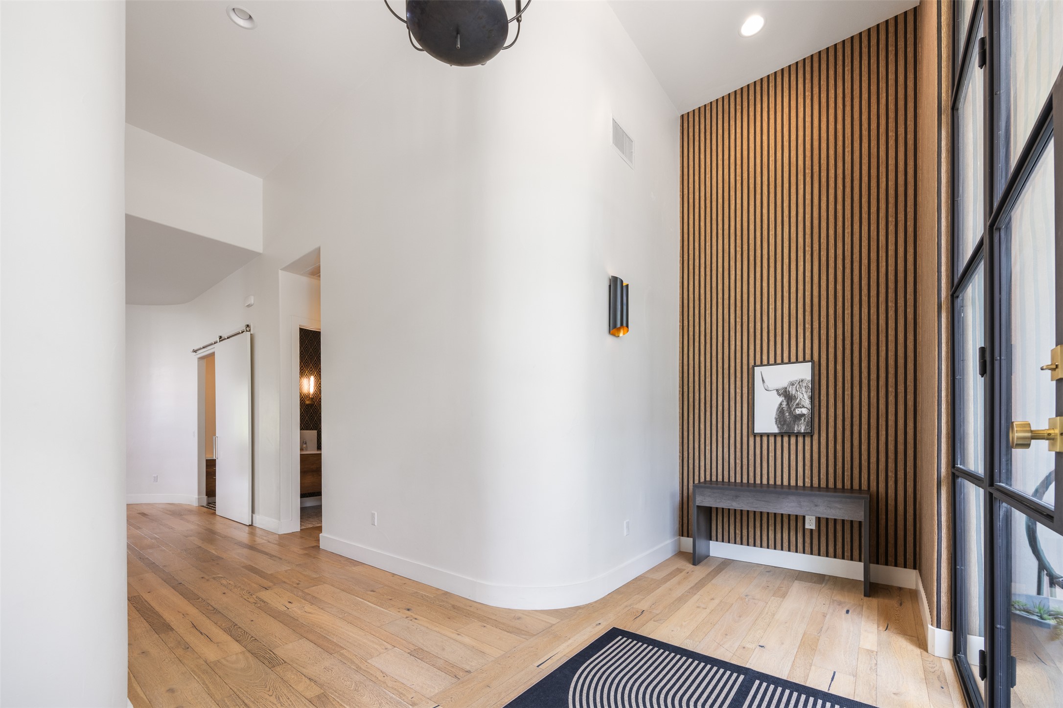 4103 Ridgelea Drive Austin, TX 78731 - Photo 5 of 26 Enter this home through a grand entrance foyer with high ceilings and rich hardwood flooring.