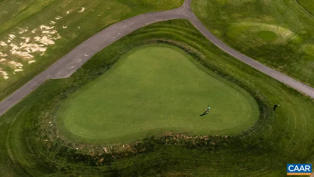 a view of a swimming pool with a yard