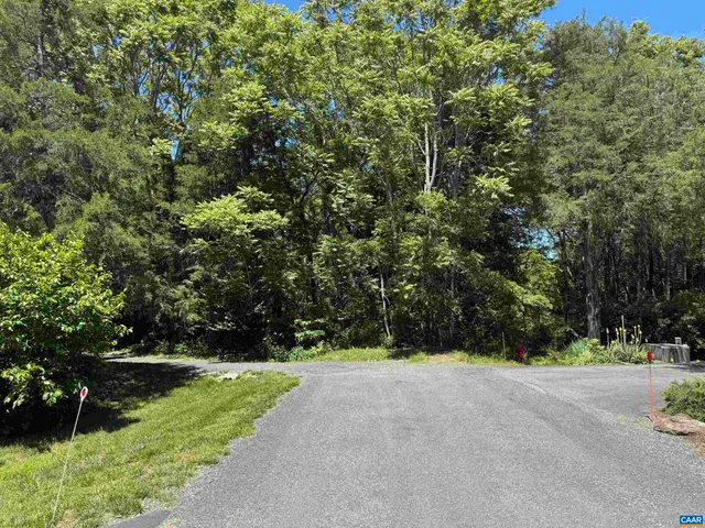 a view of grassy field with mountain
