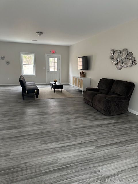 Undisclosed Address Salem, CT 06420 - Photo 13 of 17 a living room with furniture and a flat screen tv