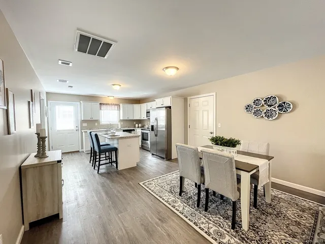 a view of a dining room with furniture