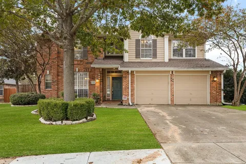 front view of a house with a garden