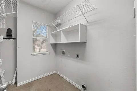a view of storage and utility room with empty racks