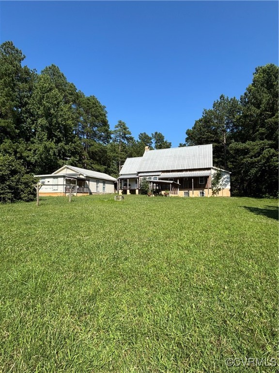2695 Bethel Church Road Green Bay, VA 23942 - Photo 3 of 39 a white house with a big yard and large trees