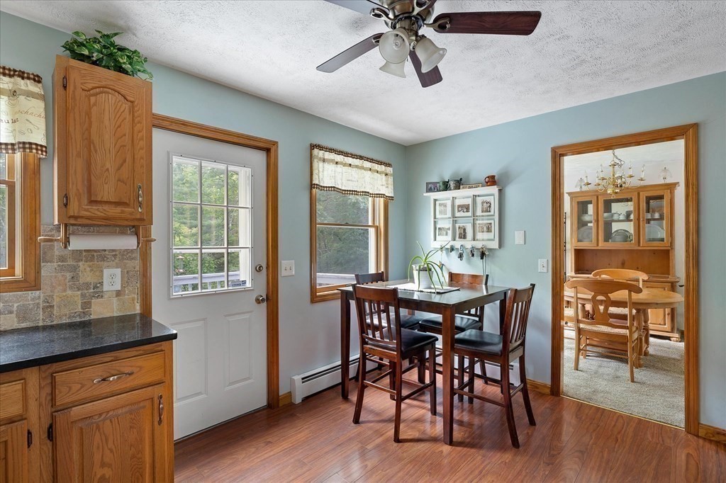 271 New Boston Road Sturbridge, MA 01566 - Photo 6 of 18 a view of a dining room with furniture window and wooden floor