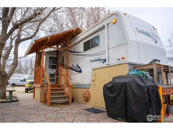 a view of outdoor kitchen with seating area