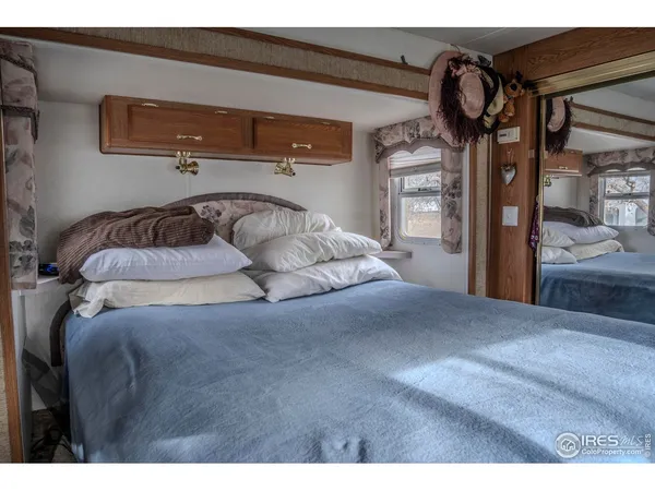 a bedroom with a bed and closet