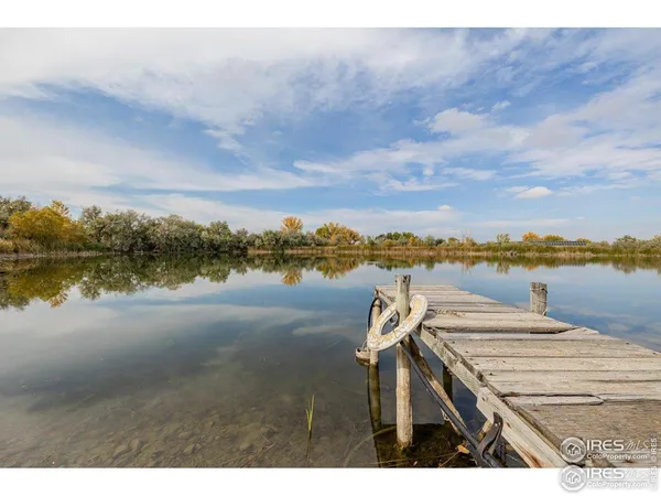 a view of a lake with houses in the background
