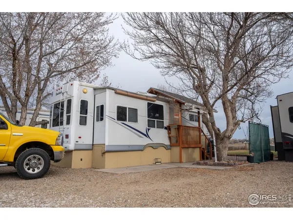 a view of a house with a car parked in front of a house