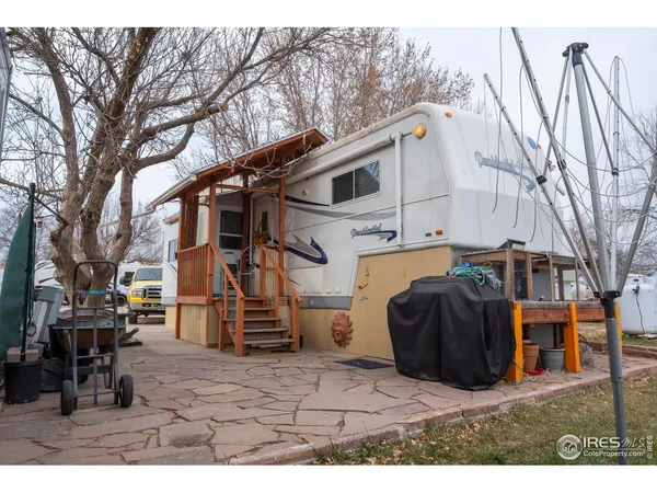 a utility house with tall trees