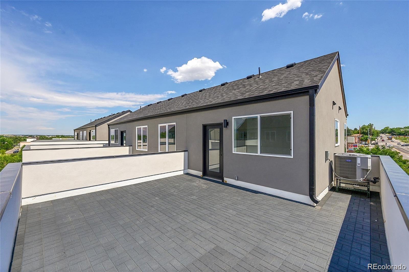 10151 West 38th Avenue Wheat Ridge, CO 80033 - Photo 22 of 50 a front view of a house with a balcony