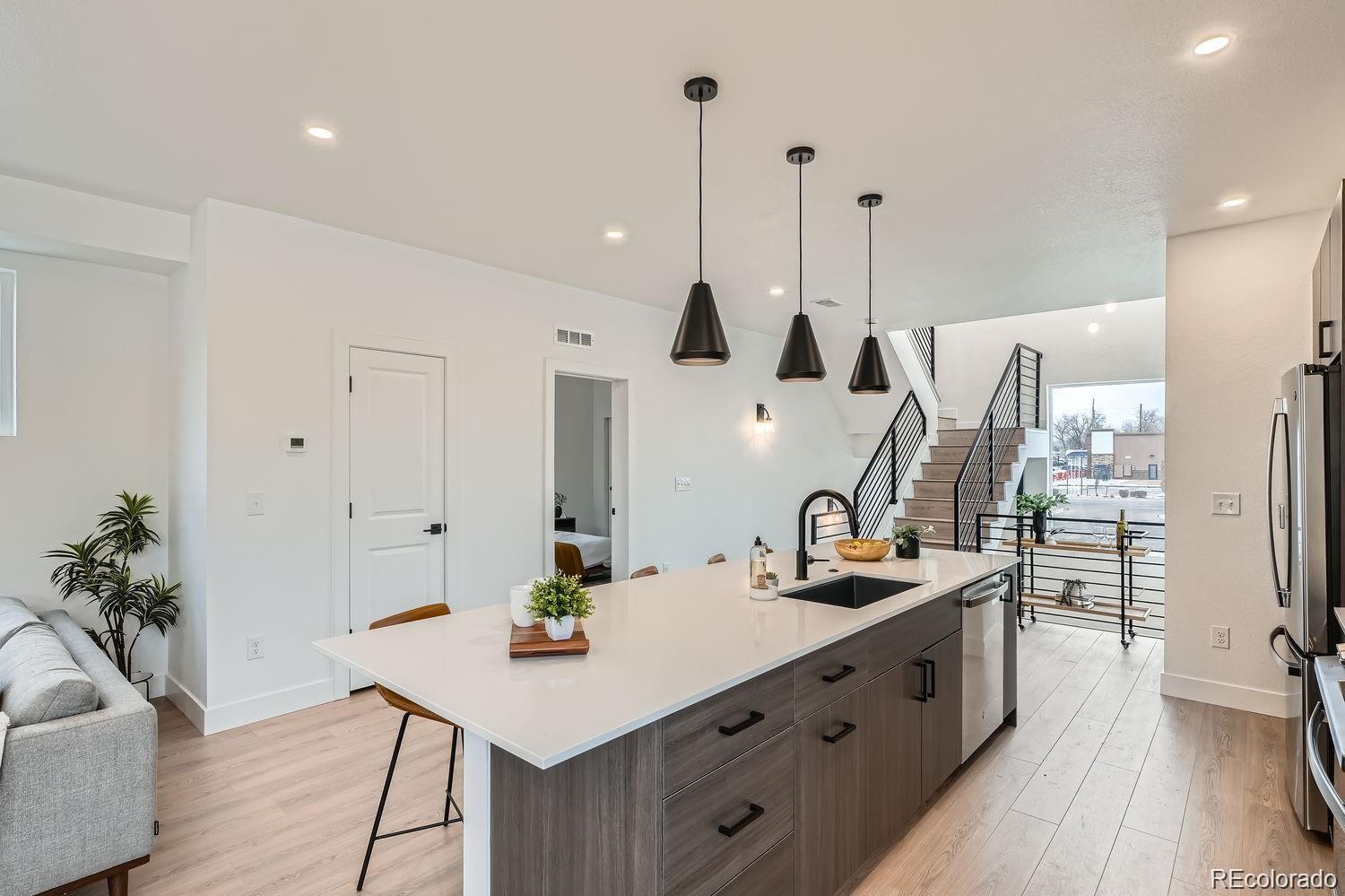 10151 West 38th Avenue Wheat Ridge, CO 80033 - Photo 8 of 50 a kitchen with sink and refrigerator