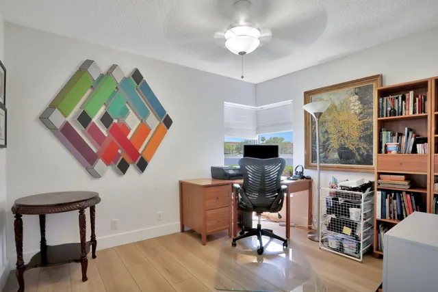a workspace with furniture window and wooden floor