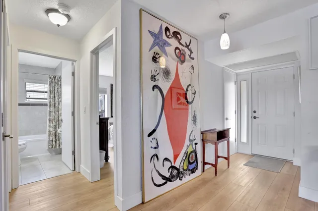 a view of an entryway with wooden floor