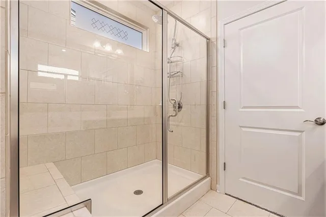 a bathroom with a glass shower door