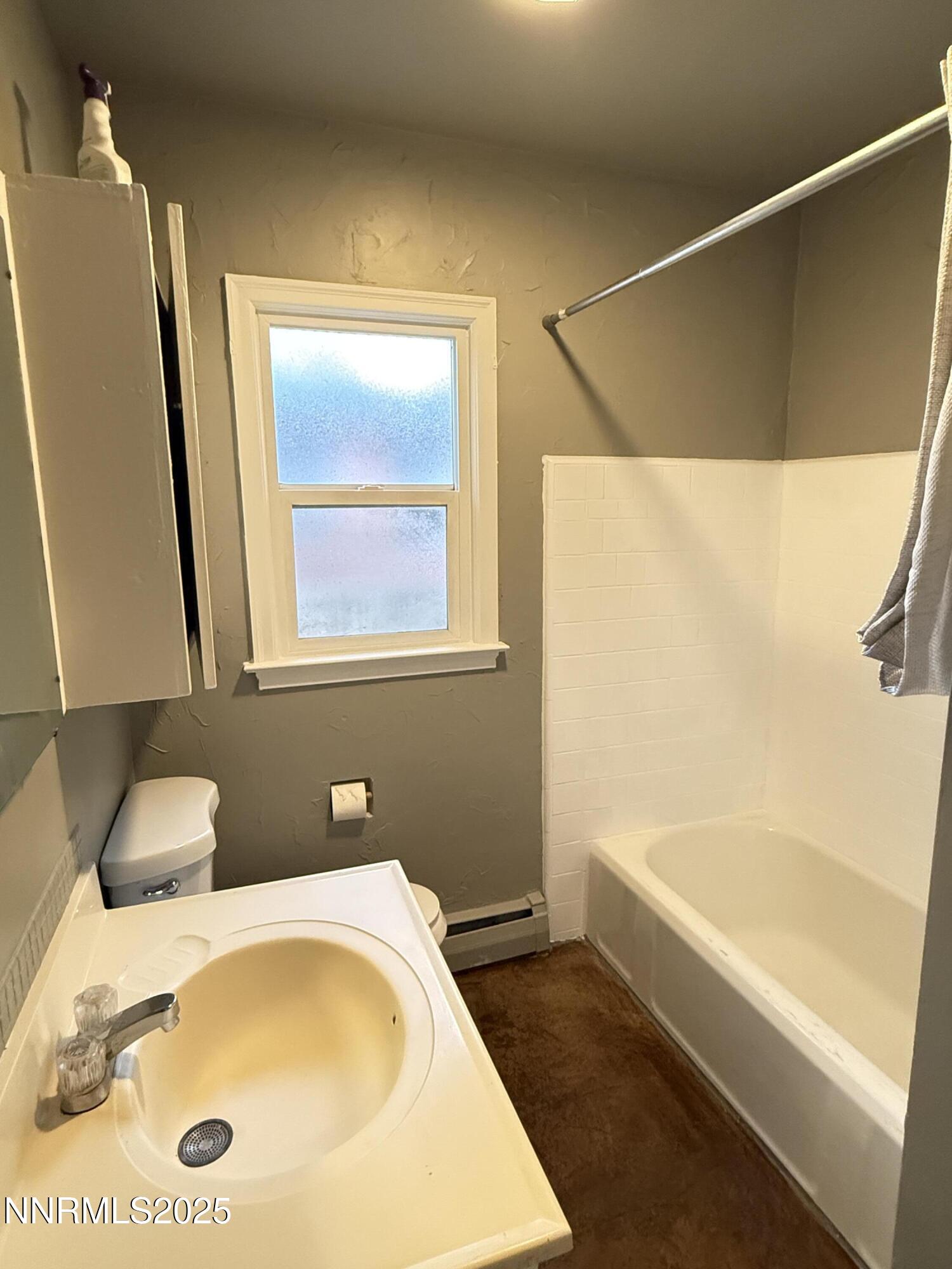 1170 Forest Street Reno, NV 89509 - Photo 11 of 32 a bathroom with a tub a sink and a large mirror
