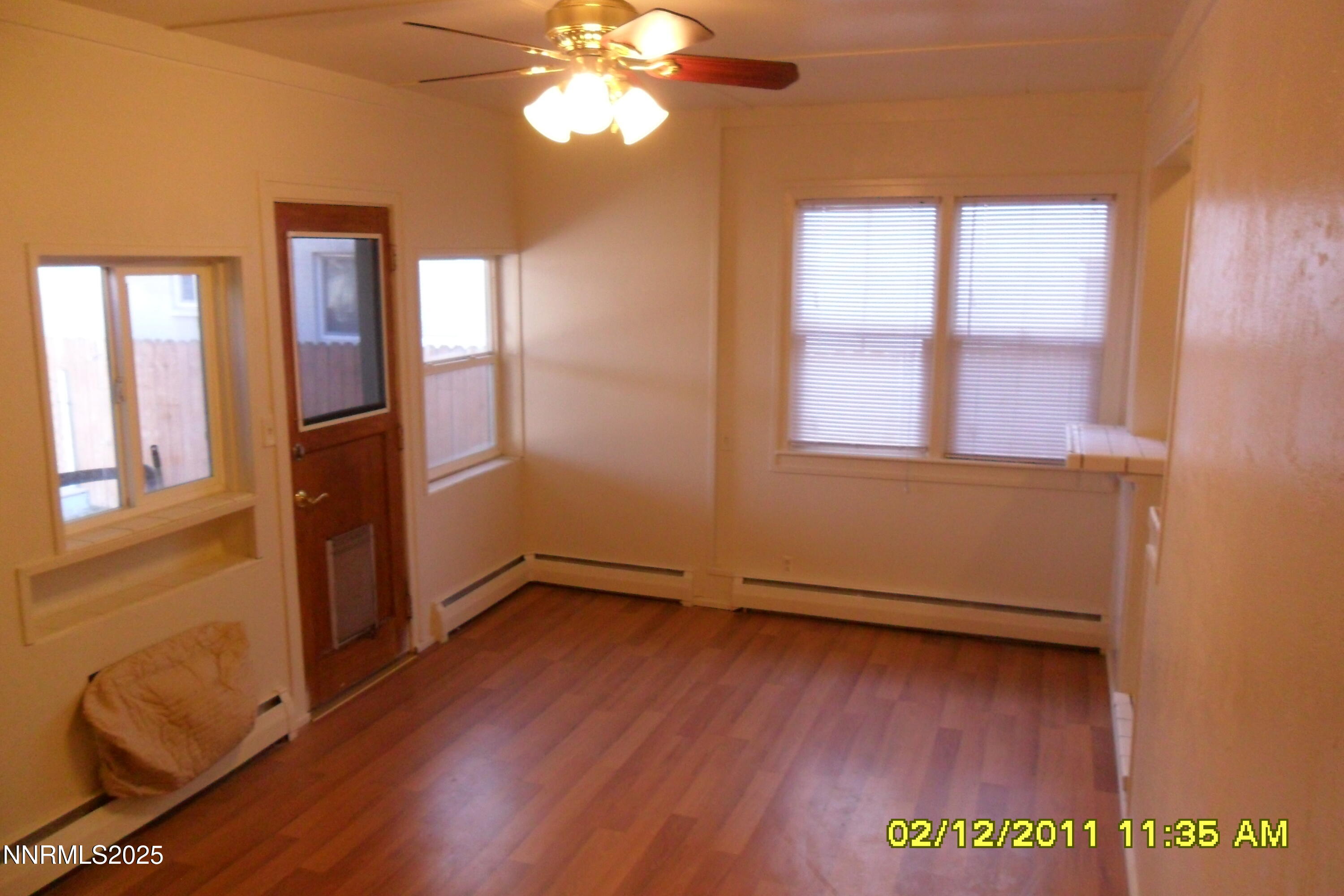 1170 Forest Street Reno, NV 89509 - Photo 22 of 32 a view of an empty room with wooden floor and a window