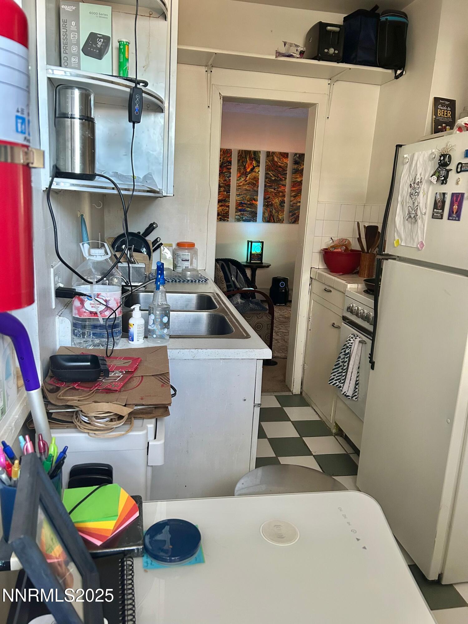 1170 Forest Street Reno, NV 89509 - Photo 29 of 32 a room with furniture a rug and a wooden floor