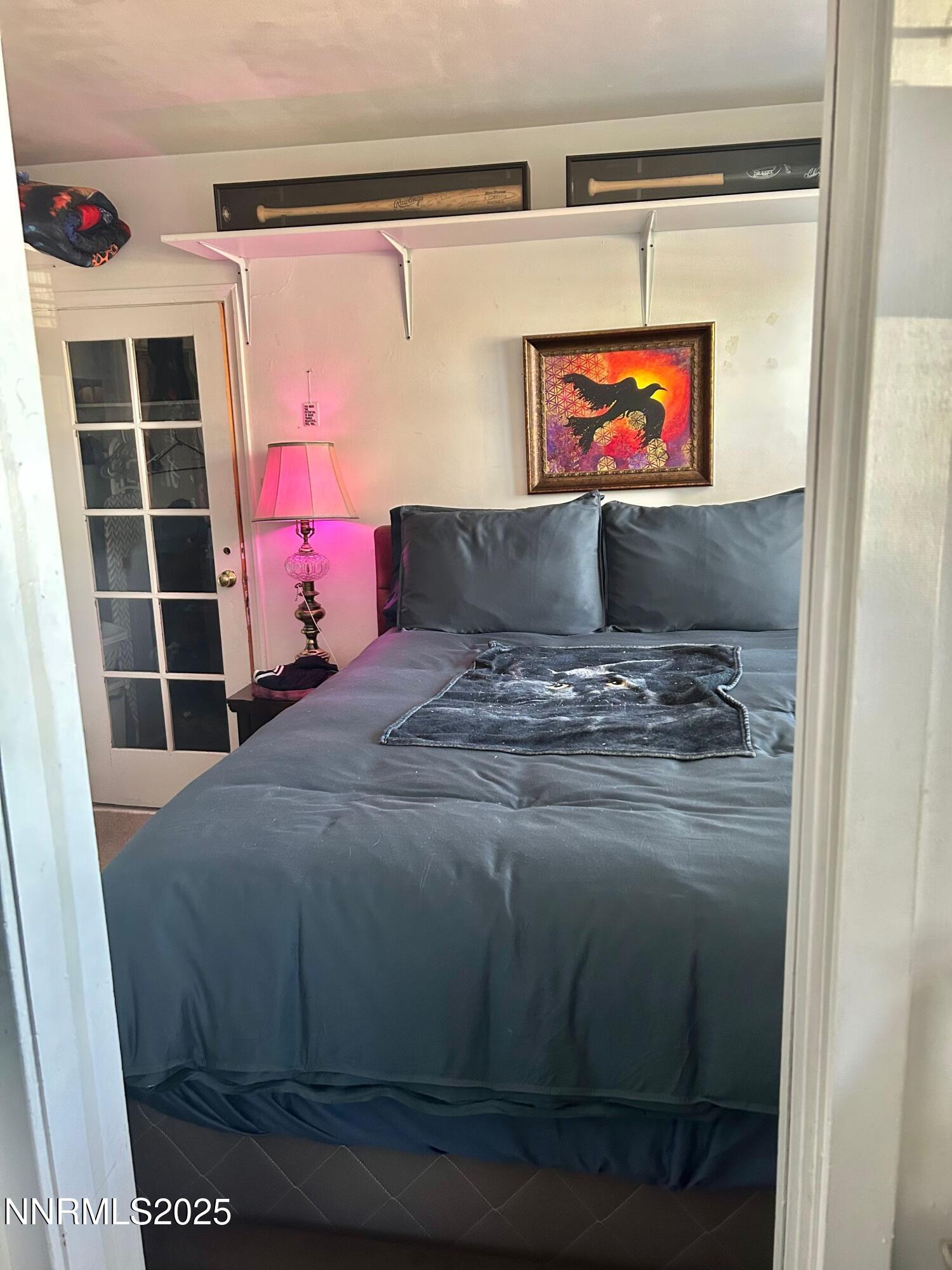 1170 Forest Street Reno, NV 89509 - Photo 30 of 32 a room with a bed and a flat screen tv