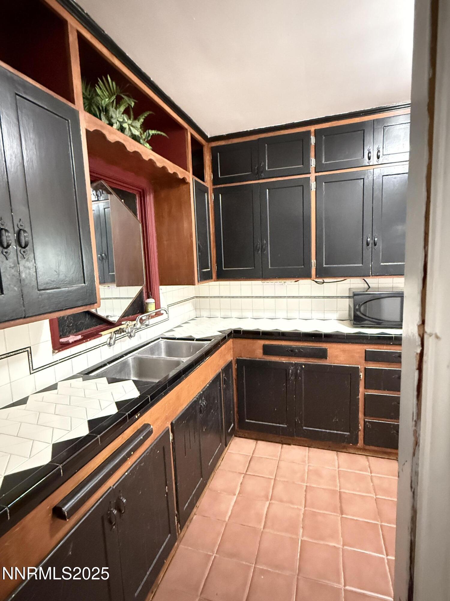1170 Forest Street Reno, NV 89509 - Photo 4 of 32 a kitchen with a sink and cabinets