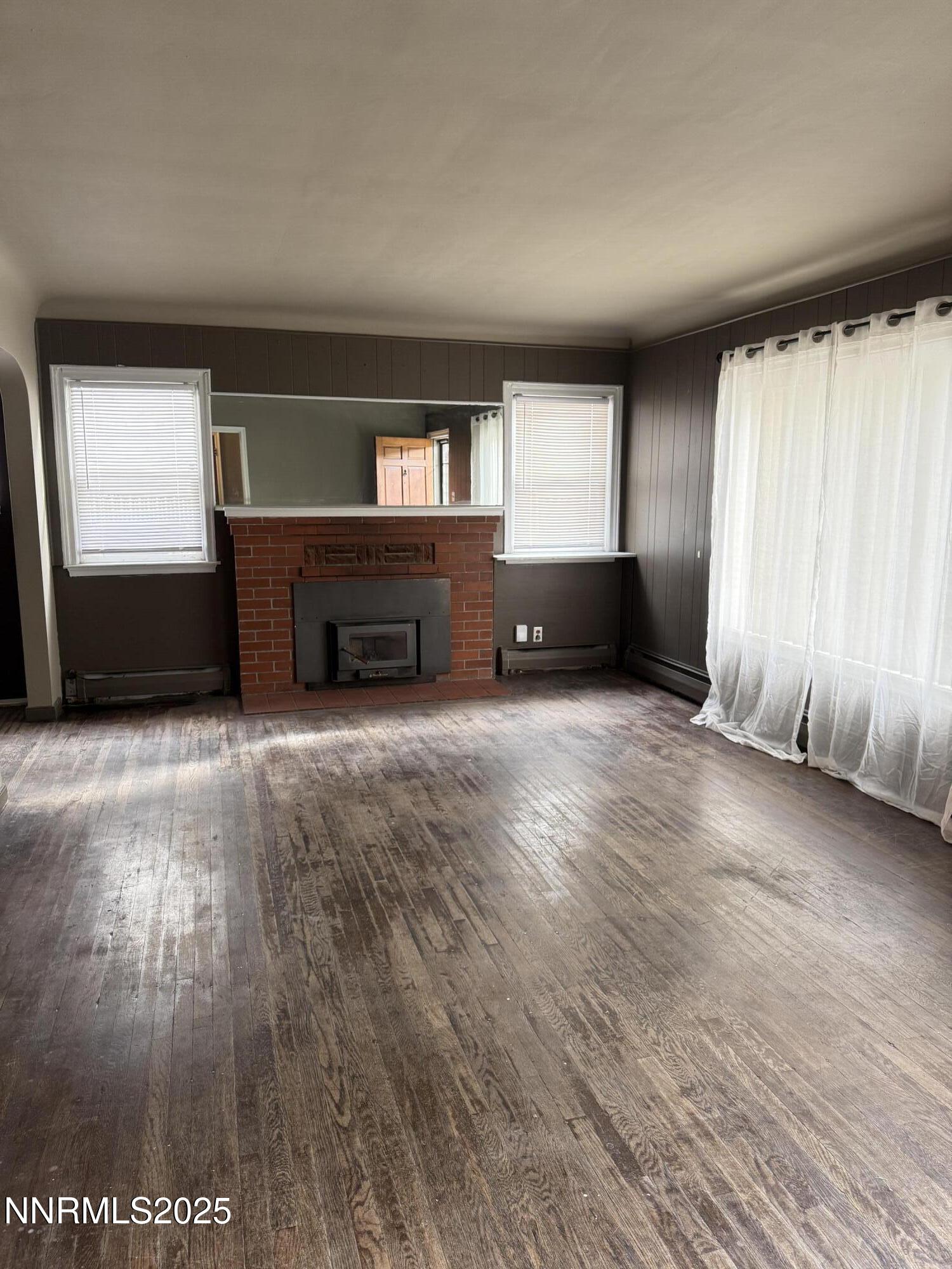 1170 Forest Street Reno, NV 89509 - Photo 9 of 32 an empty room with windows and fireplace