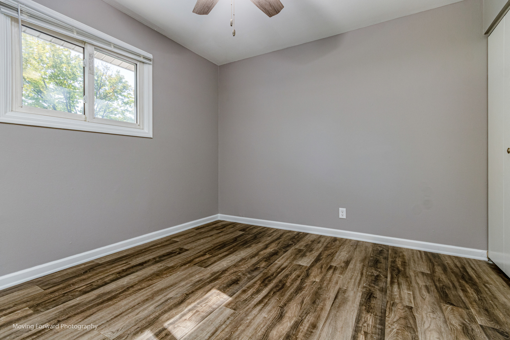 147 Queenswood Road Bolingbrook, IL 60440 - Photo 11 of 20 a view of a room with wooden floor and windows
