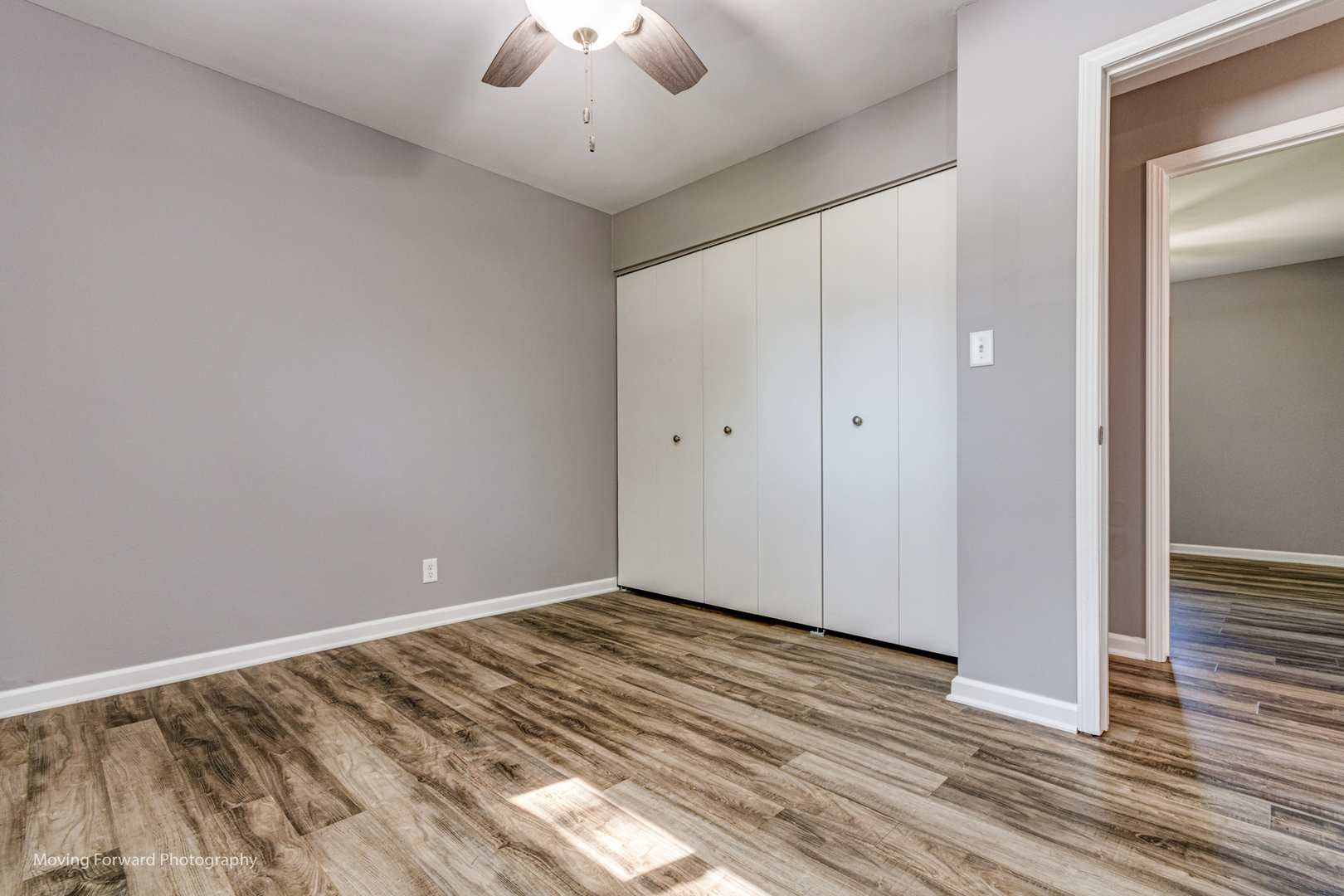 147 Queenswood Road Bolingbrook, IL 60440 - Photo 12 of 20 a view of room with wooden floor and ceiling fan
