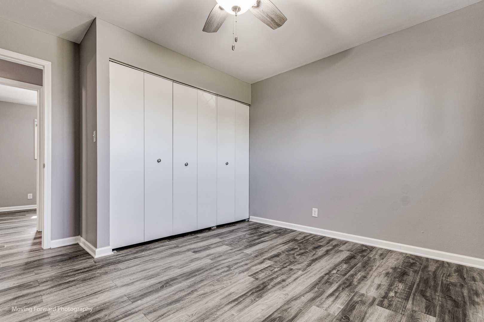147 Queenswood Road Bolingbrook, IL 60440 - Photo 13 of 20 wooden floor in an empty room with a window