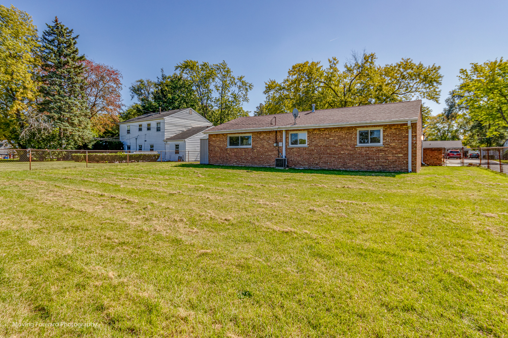 147 Queenswood Road Bolingbrook, IL 60440 - Photo 20 of 20 a house with huge green field in front of it