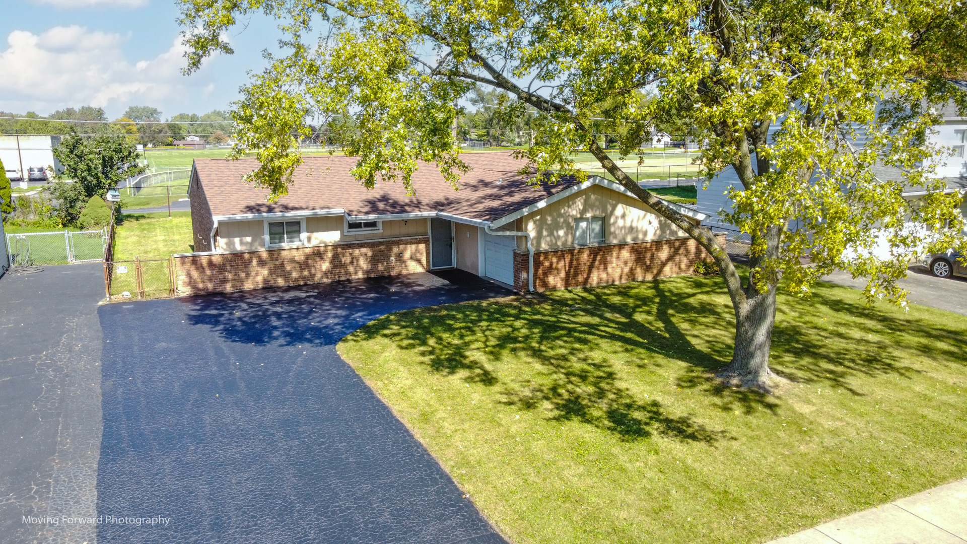 147 Queenswood Road Bolingbrook, IL 60440 - Photo 2 of 20 a house with trees in front of it