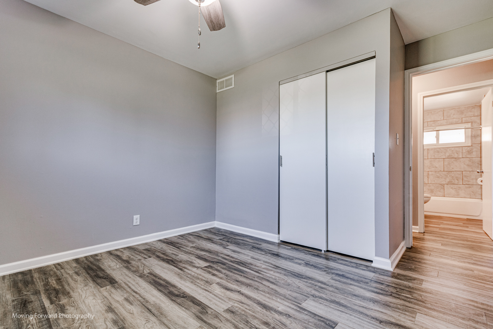 147 Queenswood Road Bolingbrook, IL 60440 - Photo 9 of 20 a view of a room with wooden floor