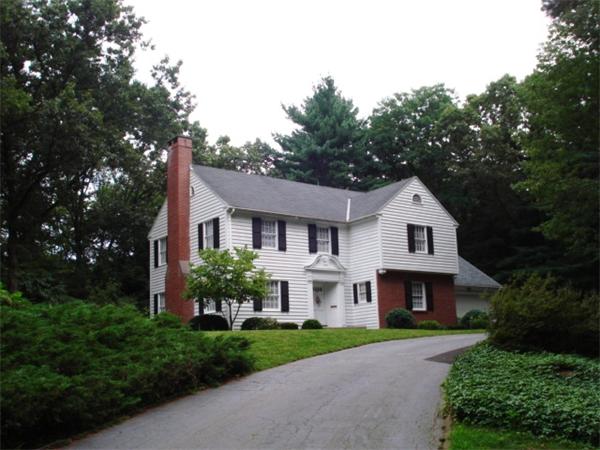 40 Woodsley Road Longmeadow, MA 01106 - Photo 4 of 16 a front view of a house with a garden and trees