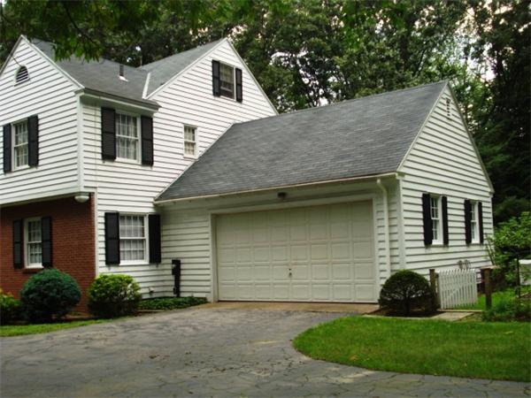 40 Woodsley Road Longmeadow, MA 01106 - Photo 5 of 16 a view of a white house with a yard and plants