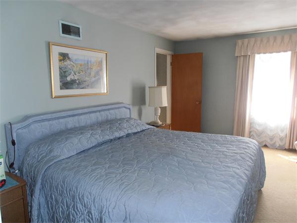 40 Woodsley Road Longmeadow, MA 01106 - Photo 9 of 16 a bedroom with a bed and a window