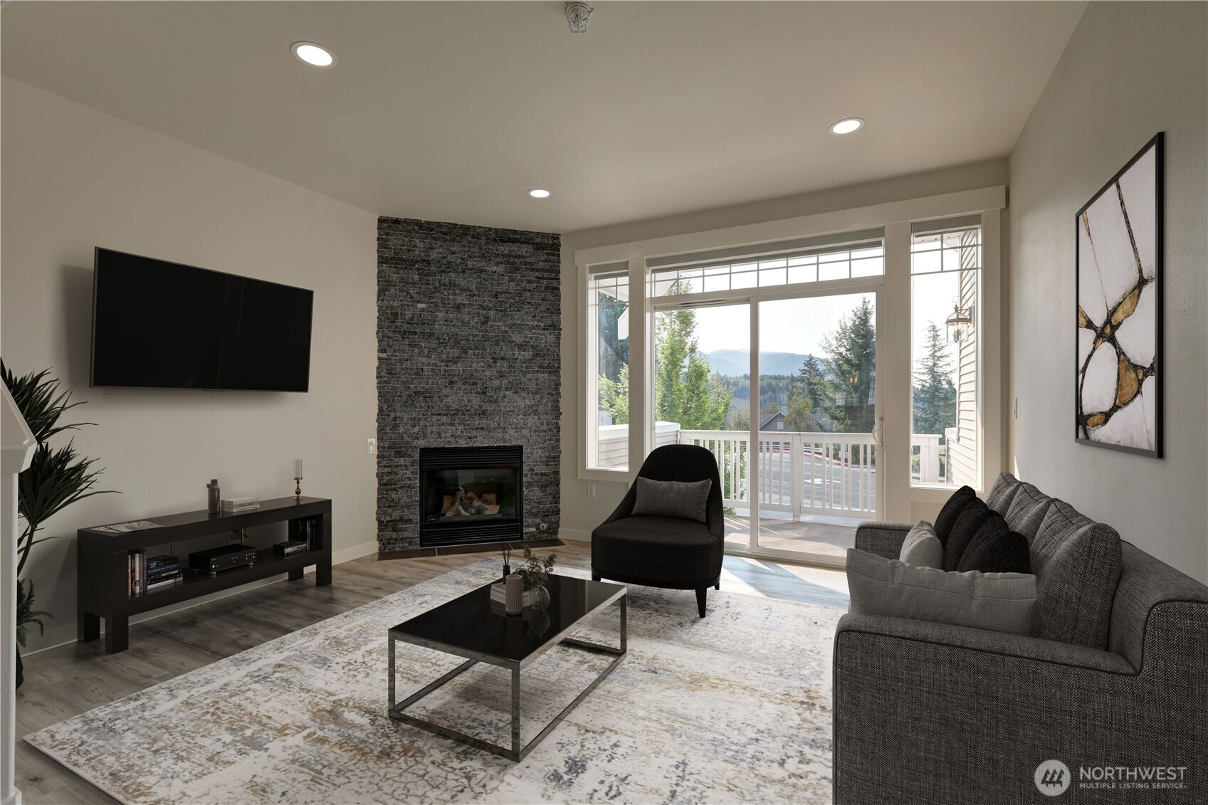 23120 Southeast Black Nugget Road, Unit A2 Issaquah, WA 98029 - Photo 2 of 18 a living room with furniture a flat screen tv and a fireplace