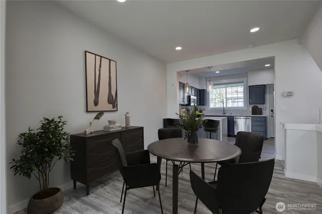 a dining room with furniture and window