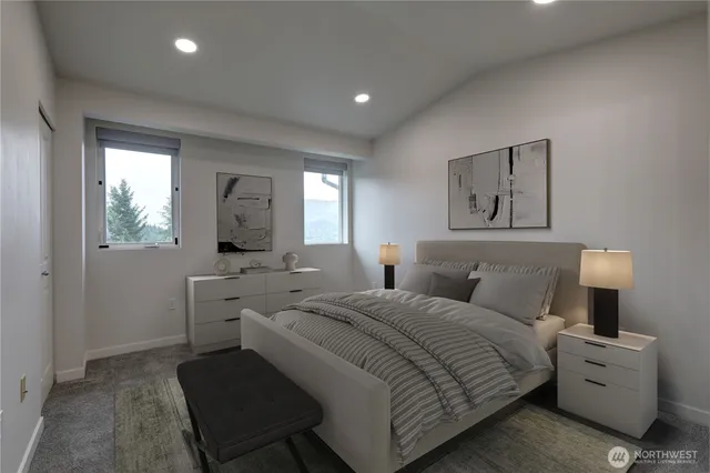 a bedroom with a bed and a couch