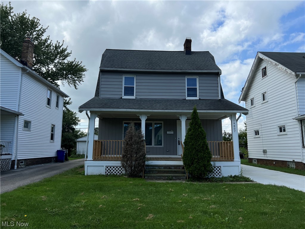 14807 Alger Road Cleveland, OH 44111 - Photo 1 of 16 View of front of home featuring a porch and a front lawn