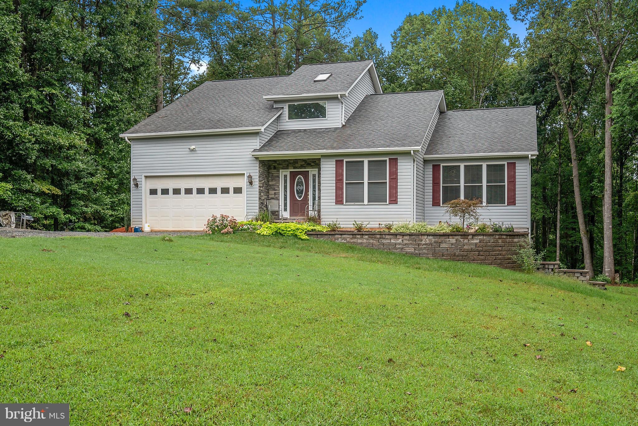 14303 Reva Road Reva, VA 22735 - Photo 1 of 25 a front view of a house with garden