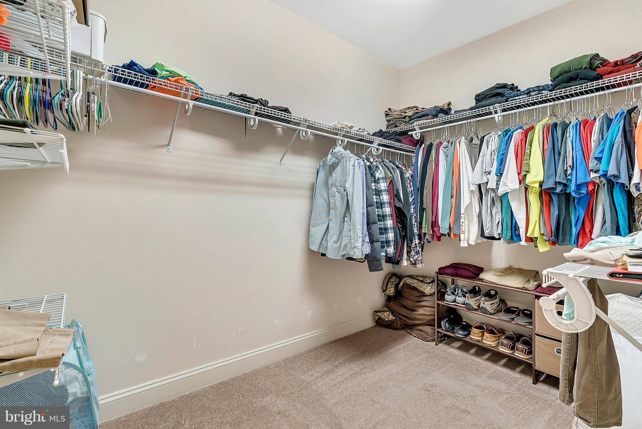 14303 Reva Road Reva, VA 22735 - Photo 18 of 25 a view of walk in closet with clothes