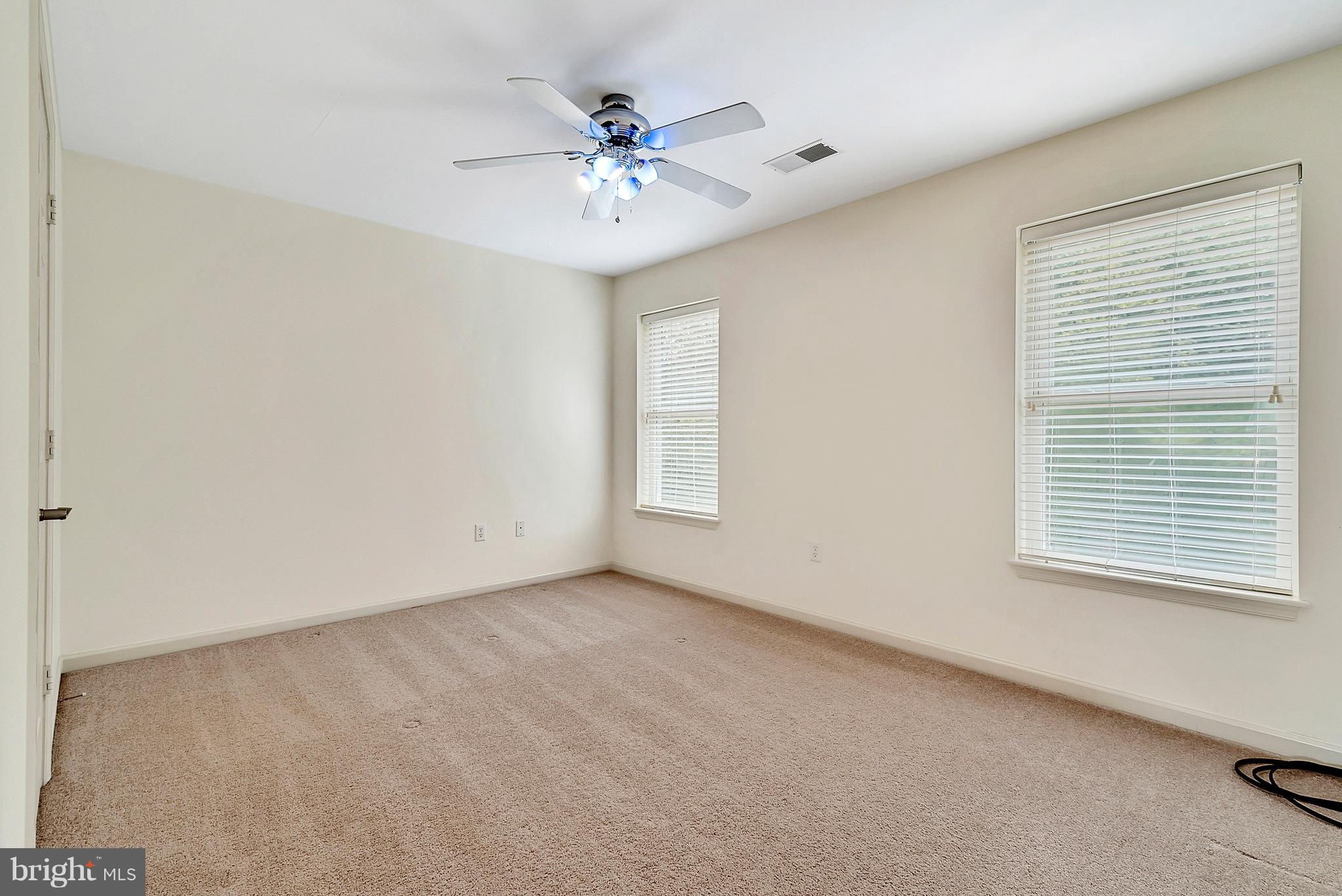 14303 Reva Road Reva, VA 22735 - Photo 21 of 25 a view of an empty room with chandelier fan and fire place