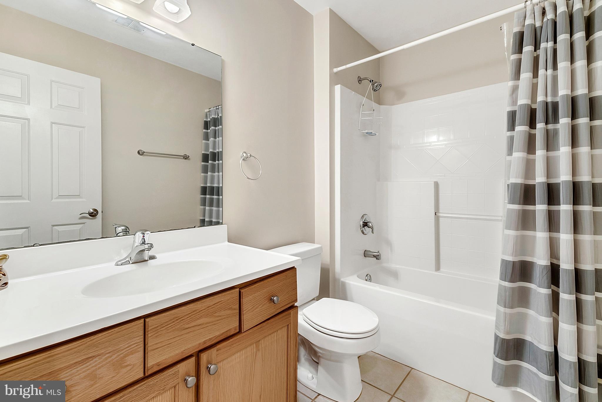 14303 Reva Road Reva, VA 22735 - Photo 22 of 25 a bathroom with a sink a toilet a shower and a mirror