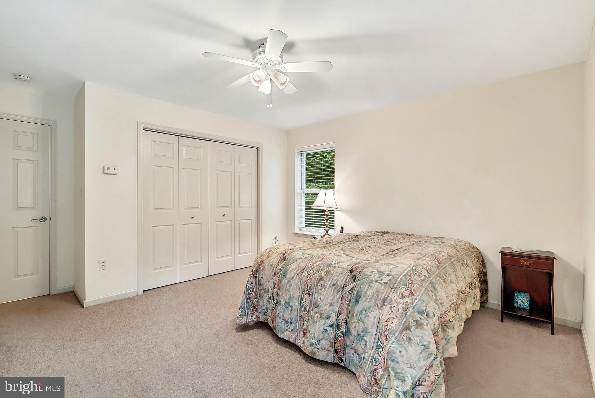 14303 Reva Road Reva, VA 22735 - Photo 24 of 25 a bedroom with a bed and a lamp