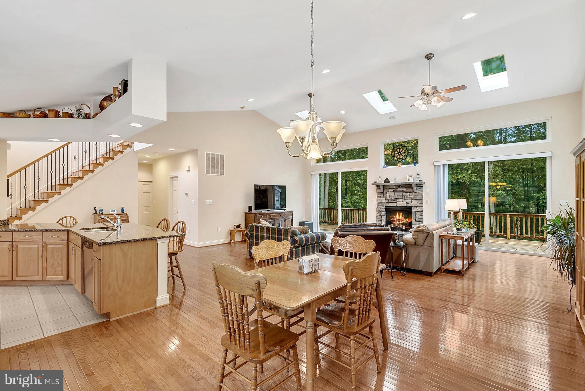 14303 Reva Road Reva, VA 22735 - Photo 7 of 25 a view of a dining room and livingroom with furniture wooden floor a chandelier