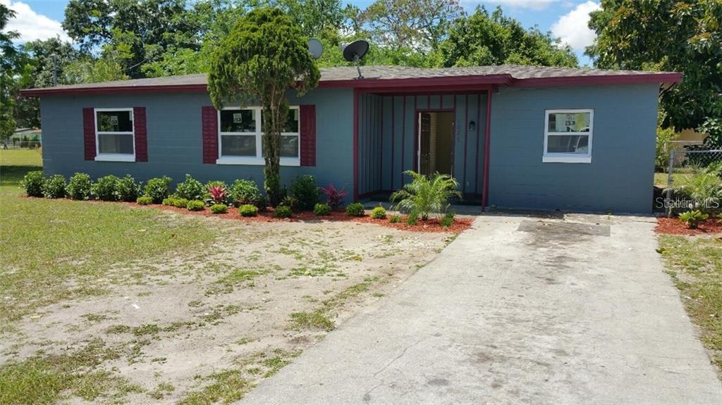 1026 Santa Barbara Road Orlando, FL 32808 - Photo 1 of 1 a front view of house with yard