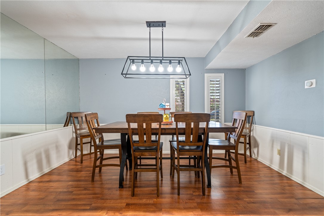 2217 Post Oak Drive Portland, TX 78374 - Photo 14 of 39 a view of a dining room with furniture window and wooden floor