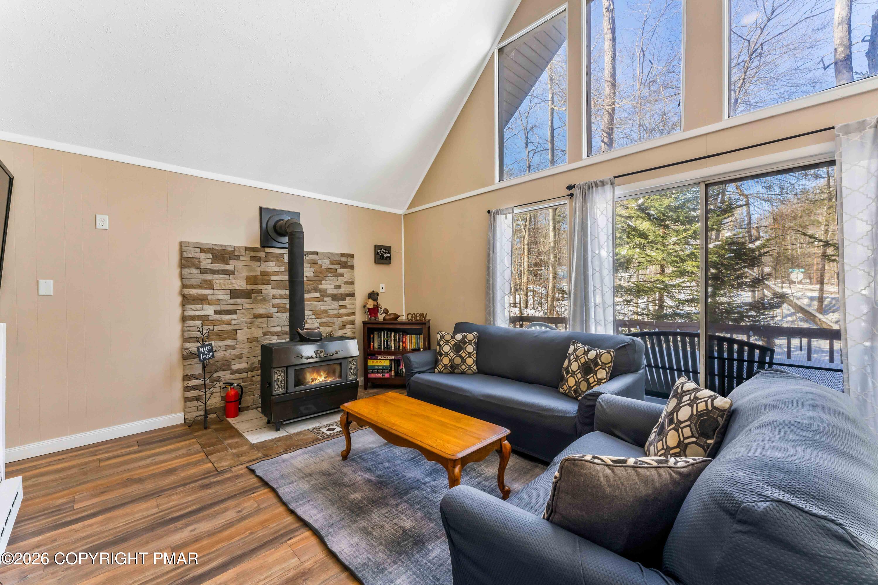 102 King Arthur Road Pocono Lake, PA 18347 - Photo 13 of 59 a living room with furniture and a large window