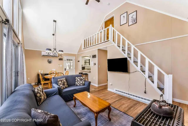 a dining room with furniture window and outside view