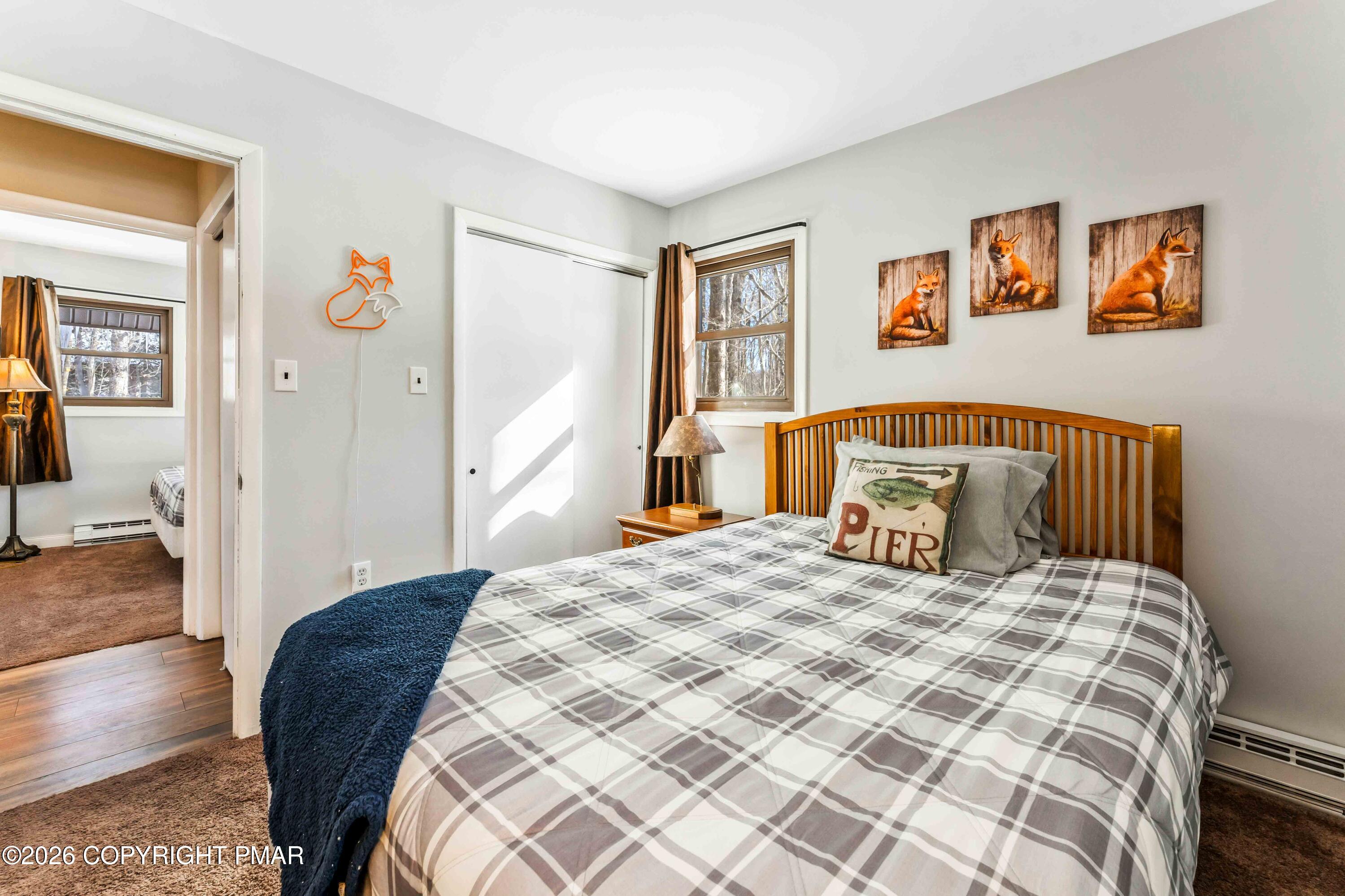 102 King Arthur Road Pocono Lake, PA 18347 - Photo 29 of 59 a bedroom with a large bed and a window