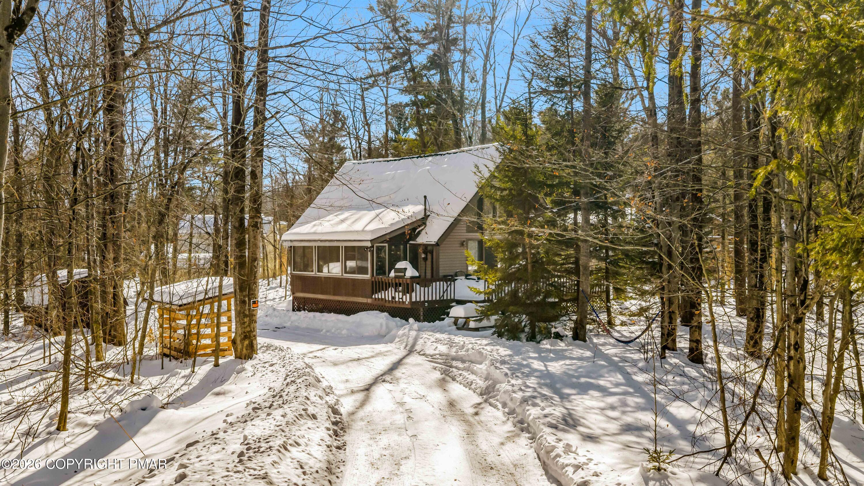102 King Arthur Road Pocono Lake, PA 18347 - Photo 3 of 59 a view of a house with a yard covered in snow